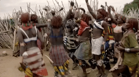 Africans Dancing using the Djembe during celebration